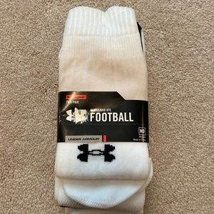 Two pair under armor, heat gear, football socks, NWT.